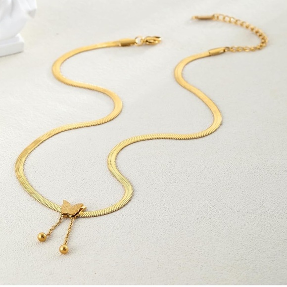 Herringbone style 14k plated gold necklace with butter slide pendant - Picture 2 of 3